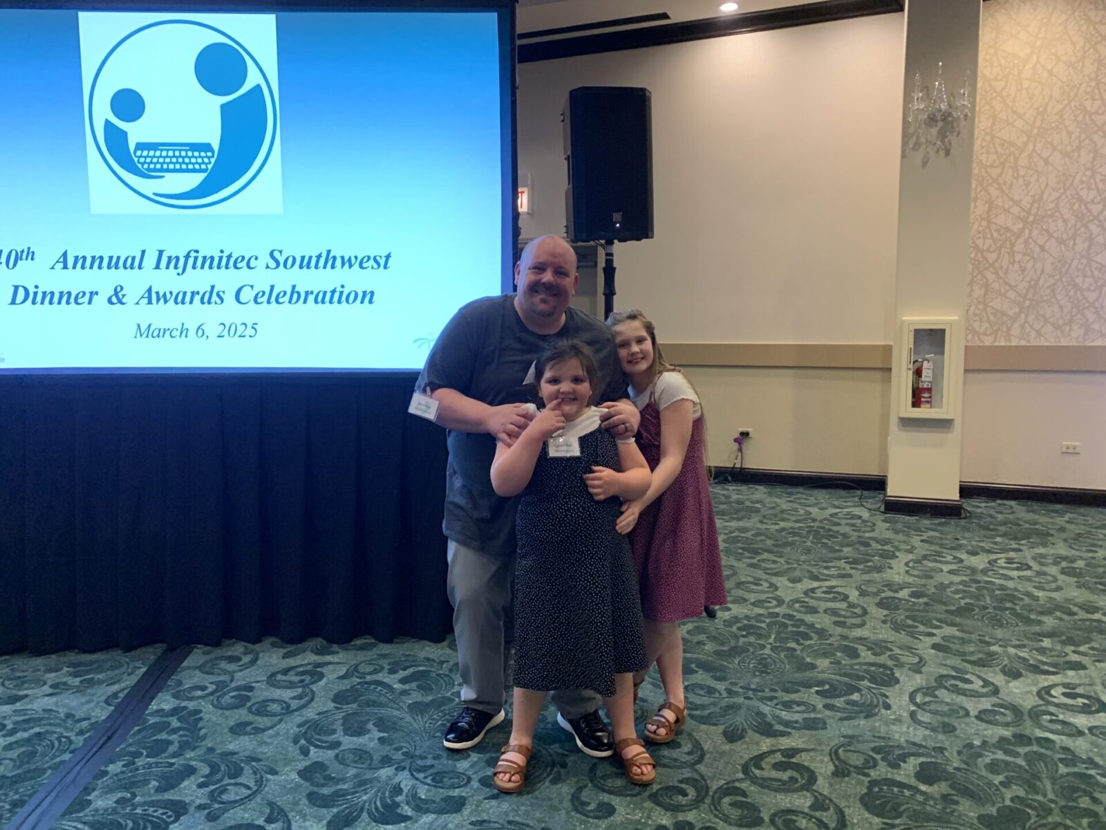 Photo of ExperiGreen family at donation event.