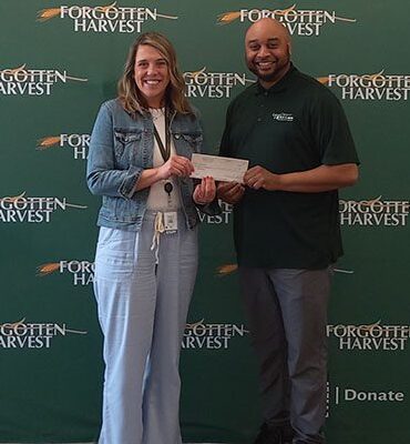 Forgotten Harvest donation with branch manager
