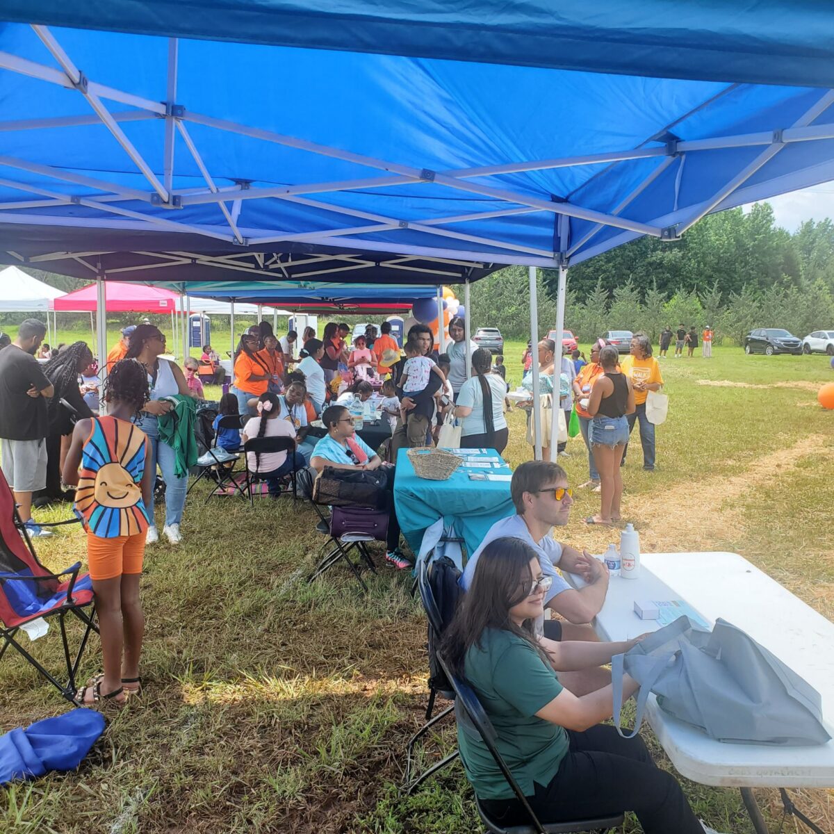 Individuals at a booth during event
